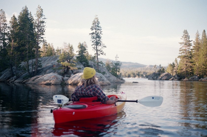 Cramped Up Utica Reservoir red kayak yellow hat