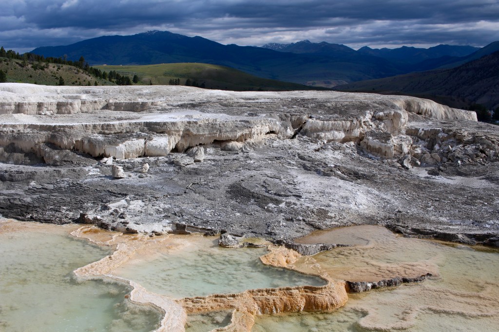 cramped up road trip yellowstone thermal dramatic sky